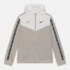 Nike Sportswear Repeat Hoodie - Training Jacket - Light Iron Ore/Summit White/Black -Kids Clothing Shop 32ddbc482289440dbc37d268ddeedffc