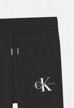 Calvin Klein Jeans Monogram Logo - Tracksuit Bottoms - Black -Kids Clothing Shop f0bcbe1e4a324479b540bb6edbd4095d