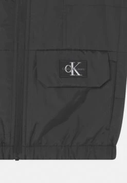 Calvin Klein Jeans Badge- Waistcoat - Black -Kids Clothing Shop fef4d2bca4e34a7ebdb1bf52ce570723